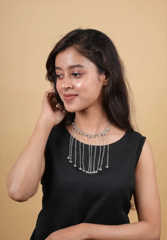 Traditional oxidized silver-tone curb chain necklace featuring a semi-circle shaped pendant with fine detailing, pearl clusters, and a delicate row of pearls along the edge, finished with an S-hook clasp.