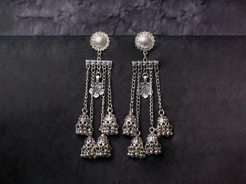 Elegant flatlay of oxidised jewelry including layered necklaces, jhumkas, bangles, and rings styled with ethnic and Western outfits – perfect for every occasion 21
