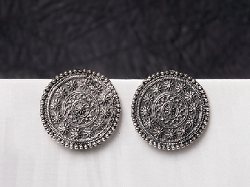 Elegant flatlay of oxidised jewelry including layered necklaces, jhumkas, bangles, and rings styled with ethnic and Western outfits – perfect for every occasion 20