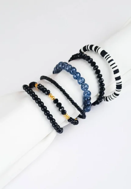 Pack of six black beaded bracelets, black with gold and grey accents, and striped beaded stretch bracelets.