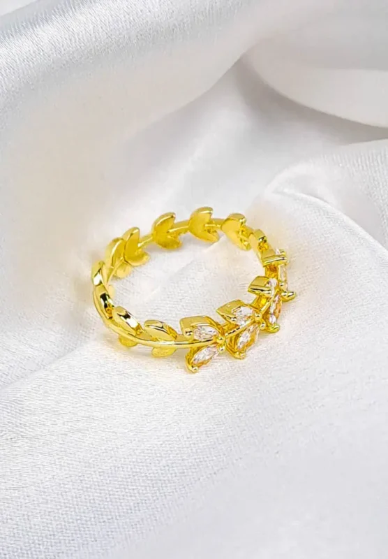 Gold adjustable ring with polished leaf motifs and open band.
