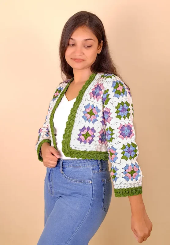 Women’s floral patchwork crochet cardigan in soft, nature-inspired tones.