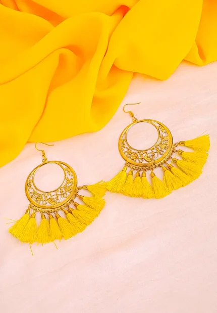 Gold hoop earrings with intricate filigree tassel drops.
