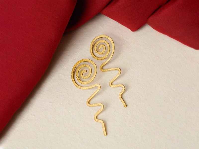 Styling earrings with classic drop designs for romantic looks