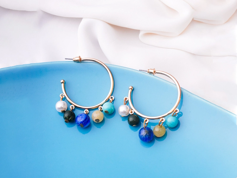 Styling earrings with classic gold hoops for everyday fashion
