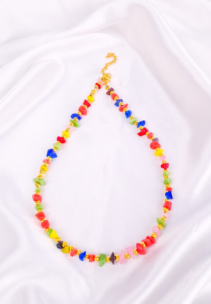 Boho-style necklace with multicolor chip stone beads and gold spacers and lobster clasp.