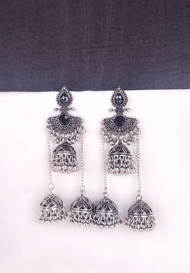 th (17) Traditional oxidized jhumka earrings featuring black stone studs and layered triple jhumkis.