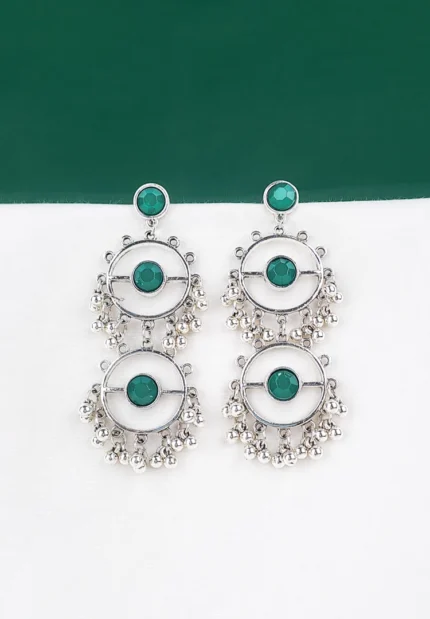 Silver geometric dangler earrings with emerald-green stones and bead drops.