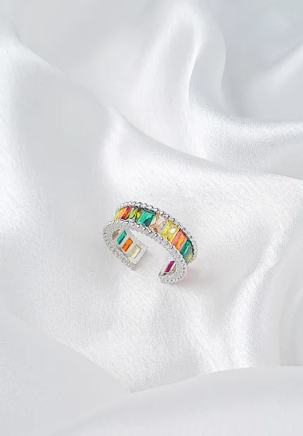 Silver-tone ring with rectangular multicolour stones and beaded borders in an open adjustable design.