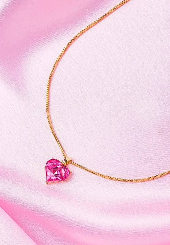 Blush Heart Pendant Necklace featuring a pink crystal heart locket on a golden base, hanging from a sleek box chain with a lobster claw clasp, radiating elegance and feminine charm.