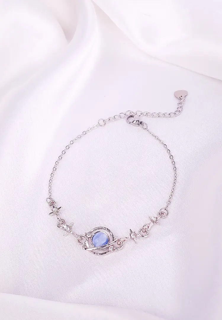 th (91) Silver-tone bracelet with blue oval stone and crystals, fine chain and secure clasp.