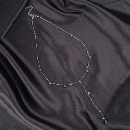 Silver Y-shaped stainless steel necklace with bead details and adjustable lobster clasp.