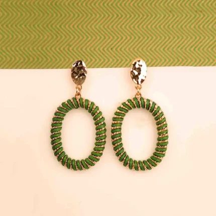 "Green and gold chunky spiral hoop earrings with a polished finish and push-back closure, offering a trendy statement style. "