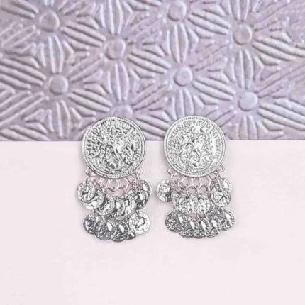 a small, round gold-tone stud earring featuring an embossed or stamped design resembling an ancient coin or medallion, with several small, matching coin charms dangling from the bottom edge.