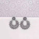 Large, crescent-shaped oxidized silver drop earring, also known as a Chandbali, featuring a highly textured surface of dense, tiny seed bead clusters and a small floral stud at the top.