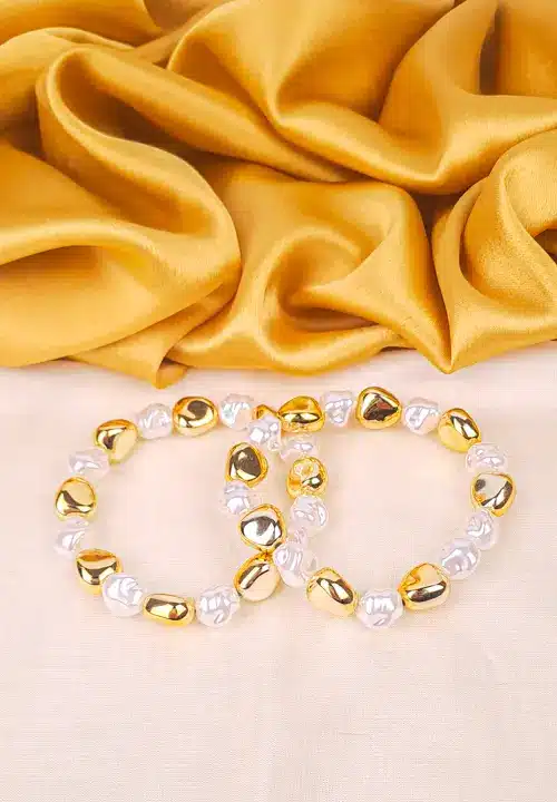 765-th Stretch bracelet with chunky gold-toned beads and irregular faux pearls for a bold, organic silhouette.