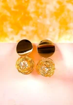 Drop earrings with wire globes encasing faux pearls, finished with smooth disc studs and post closures for minimalist style.