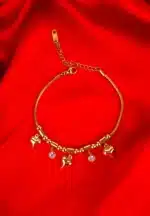  Gold bracelet with heart and bead charms on flexible snake chain.