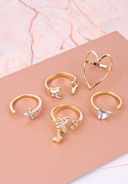 Elegant gold-plated women’s rings featuring butterflies, crystals, and heart shapes from Discov Accessories.