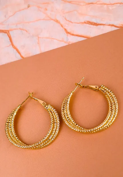 Beaded texture hoop earrings with elegant detailing.