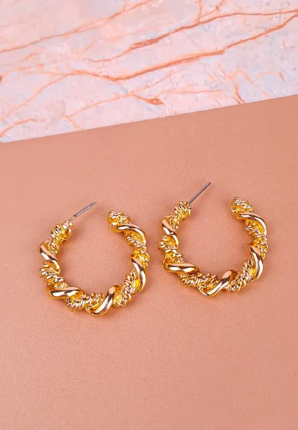 Twisted gold hoop earrings with rope texture, polished finish, and push‑back closure.