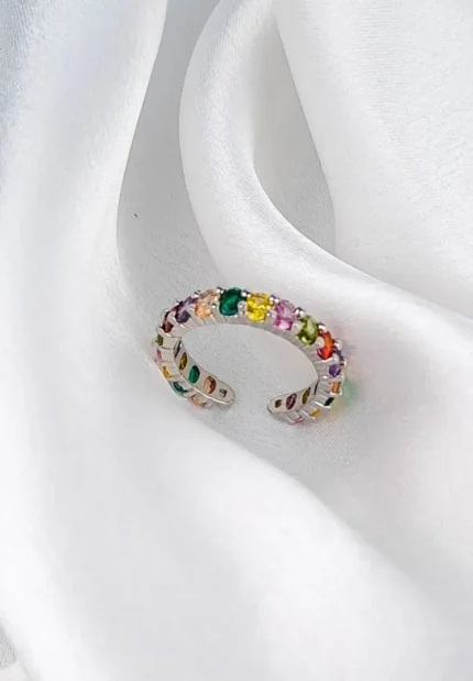 Silver-tone open ring with multicolour faceted gemstones in a gradient layout and adjustable fit.