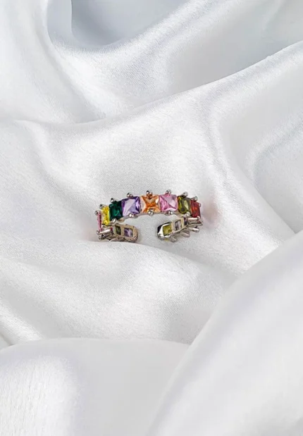 Silver-tone ring with multicolour faceted gemstones in a clustered design and adjustable open fit.