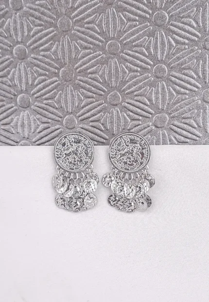 a small, round gold-tone stud earring featuring an embossed or stamped design resembling an ancient coin or medallion, with several small, matching coin charms dangling from the bottom edge.