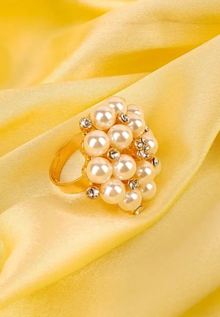 Cocktail ring with clustered pearls and rhinestones on gold-tone adjustable band.