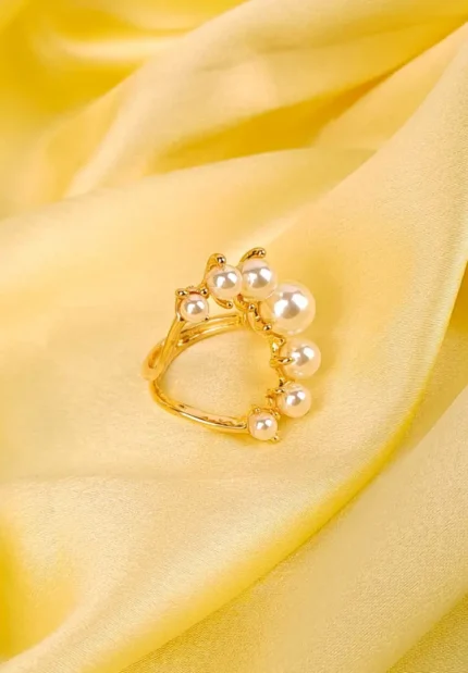 Dual-band adjustable ring with clustered pearls and polished metallic finish, exuding modern elegance.