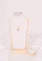 "Jewelry set with pearls and rhinestones—includes pendant necklace, stud earrings, and adjustable band ring. "