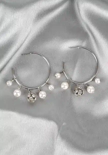 Silver hoop earrings with dangling pearls and crystal charms, polished finish, and push-back closure for elegant style.