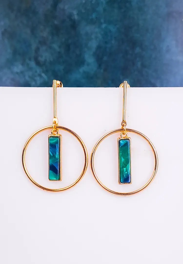th - 2025-12-08T123242.338 Geometric open circle earrings with resin accents and sleek finish, secured with post closure.