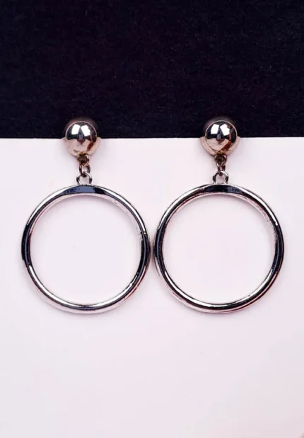 "Silver double hoop earrings with bold ball studs and polished finish, featuring secure push-back closure. "