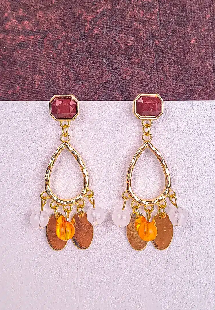 th - 2025-12-08T131501.710 Gold teardrop dangle earrings with faceted gemstones and mixed beads, finished with a textured frame and post-back closure.