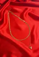 Stylish gold layered herringbone chain necklace with heart pendant and secure clasp