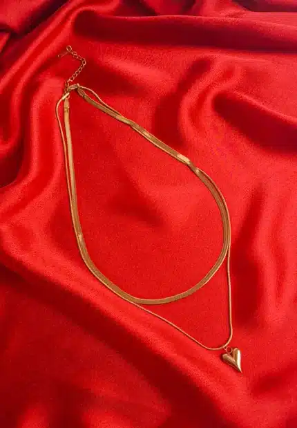 Stylish gold layered herringbone chain necklace with heart pendant and secure clasp