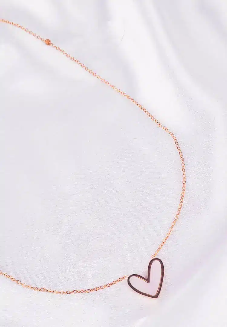 th - 2025-12-12T151254.455 Gold chain necklace with open heart pendant and adjustable lobster clasp.