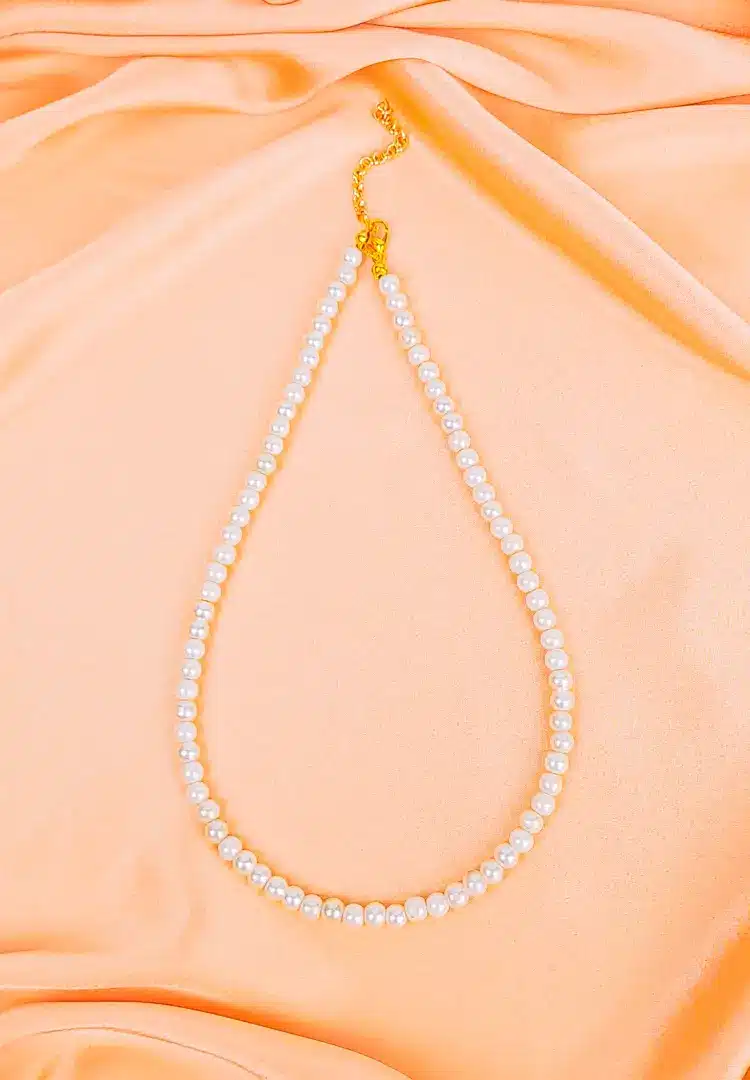 th - 2025-12-12T160103.078 Classic single-strand pearl bead necklace with a gold adjustable clasp, showcasing a polished, elegant finish for a timeless look.